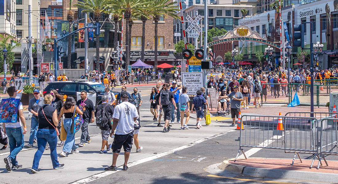 Pedestrians and Comic-Con fans in front of the San Diego Convention Center